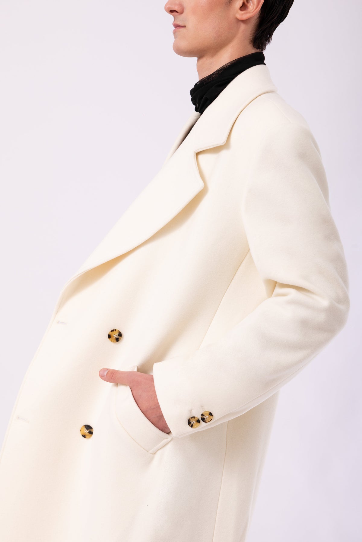 Cappotto oversize avorio vestibilità ampia design minimal luxury